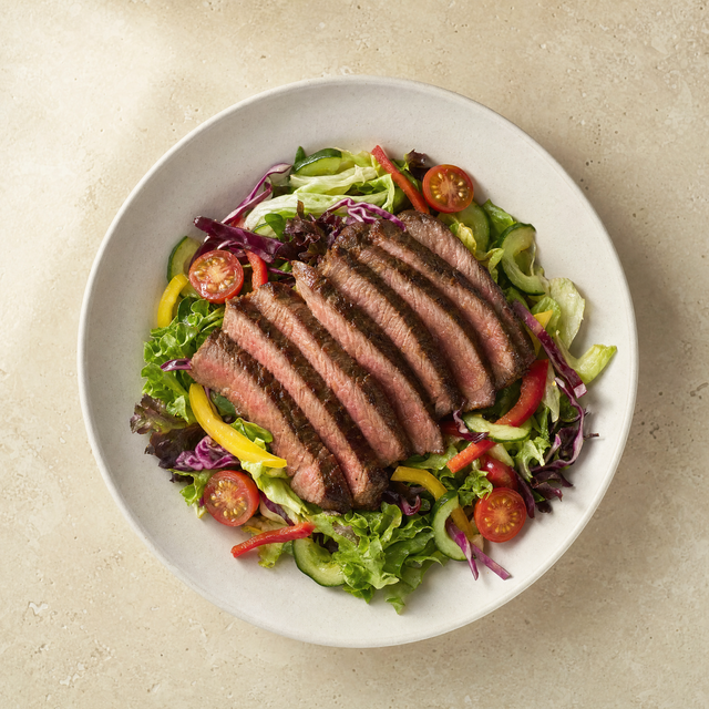 Beef salad with mixed vegetables and cherry tomatoes