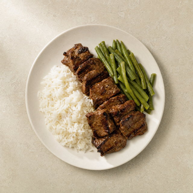 Sour beef kebab with rice and green beans