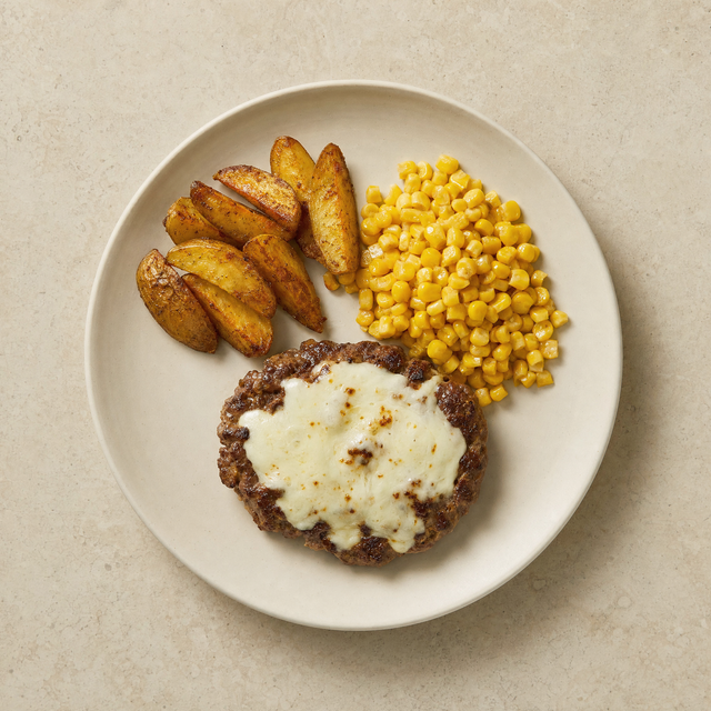 Mozzarella burger patty with roasted potatoes and corn