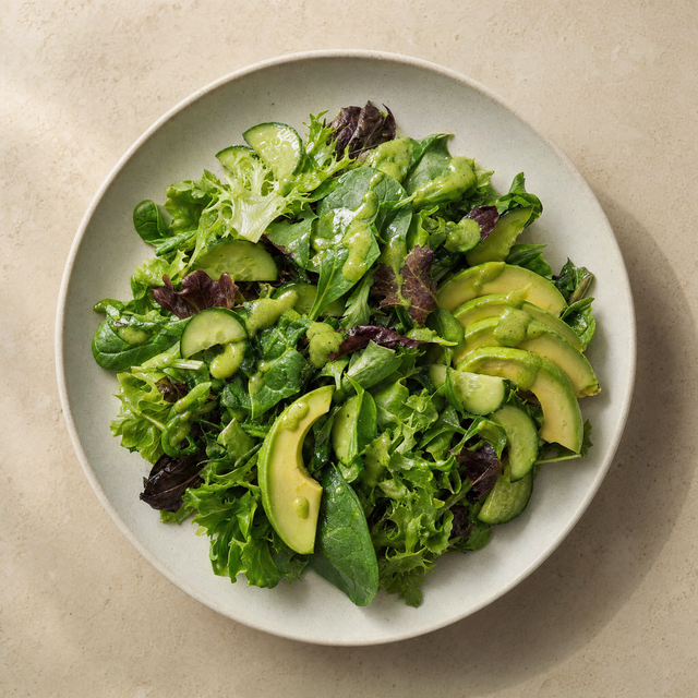 Green salad with avocado green sauce