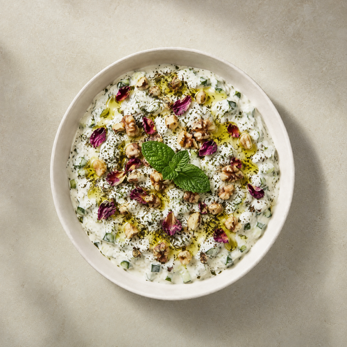 Bowl of mast-o-khiar, yogurt with cucumber and dried mint